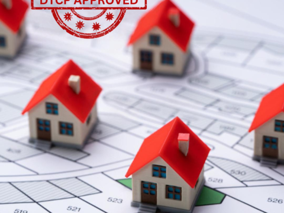 DTCP-approved residential plots with houses on a property layout.